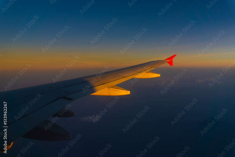 Airplane wing on blue sky cloud window view travel background Airplane wing on blue sky cloud window view travel background