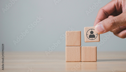 Hand holds wood cubes with person data, Customer psychology profile or characteristics, Buyer personal and target customer concept.