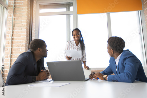 team of african successful people behind a laptop  © Alexandr