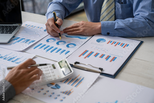 Bookkeeper accountant or financial expert, male economist accounting money with statistics graphs pointing on the accounts for investment results and income Company expenditure