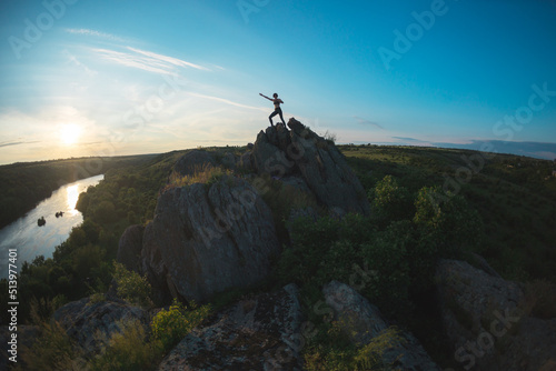 silhouette of a girl on top of a mountain