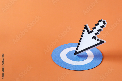 Pixel digital arrow mouse pointer modern technology as the arrow hit the target. Minimal creative concept with copy space.