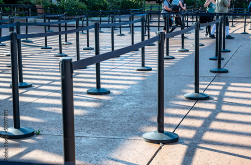 Roped line for crowd control at the entrance of a park photo