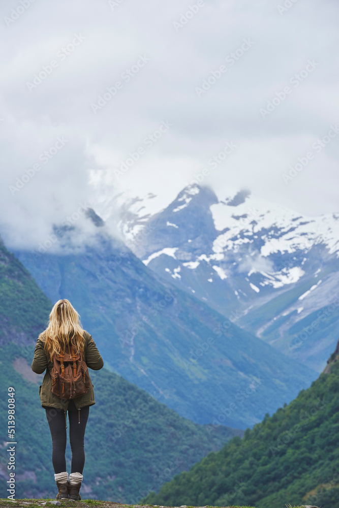 Travel adventure woman enjoying view of majestic glacial valley on exploration discover beautiful earth