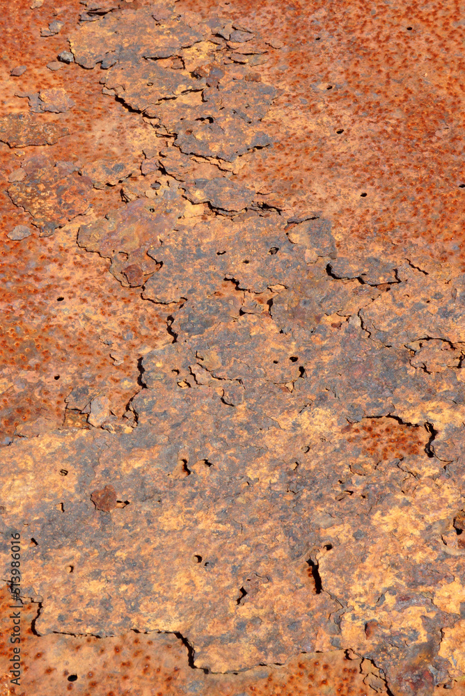 Closeup of surface of flaking, weathered, rusty metal Closeup of surface of flaking, weathered, rusty metal