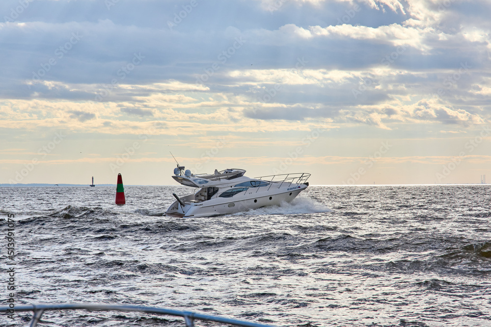 Naklejka premium Luxury private motor yacht sailing in the bay