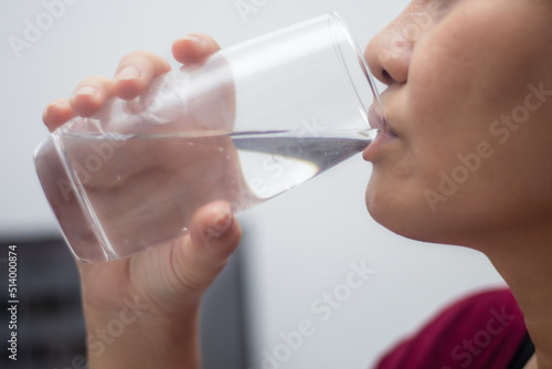 woman drinking water close up