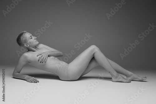 Portrait of tender young girl posing in underwear. Black and white photography. Body-positivity