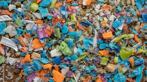 Close-up on micro plastic particles. The concept for water pollution and global warming. Macro shot on a bunch of microplastics that cannot be recycled.