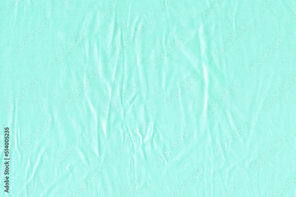 The texture of a natural light pale blue fabric. Light uneven crumpled fabric. Abstract background of light fabric.