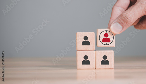 Hand holds wood cubes with person data, Customer psychology profile or characteristics, Buyer personal and target customer concept.