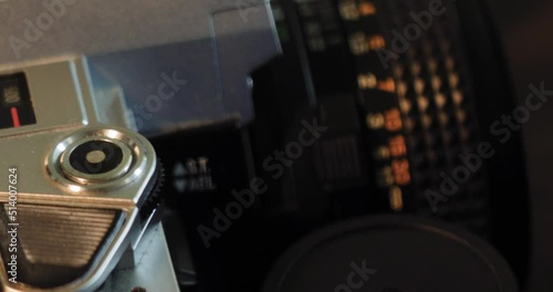 Wallpaper Mural Macro Dolly of Vintage and Antique 35mm Cameras and Equipment slides over top of three 35mm cameras Torontodigital.ca