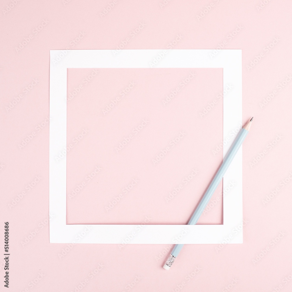 Pencil on a pink paper background, white frame with copy space for text, minimalism, creative and business concept, pastel colored 
