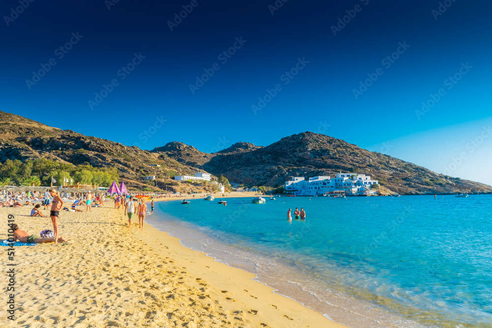 Ios, Greece, 10 June 2022: Tourists enjoying Manganari beach