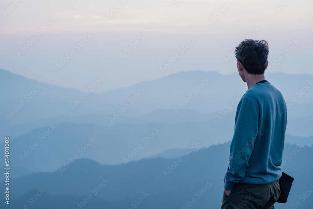 Fototapeta premium hiker man relax with wellbeing and happy feeling on top of mountain