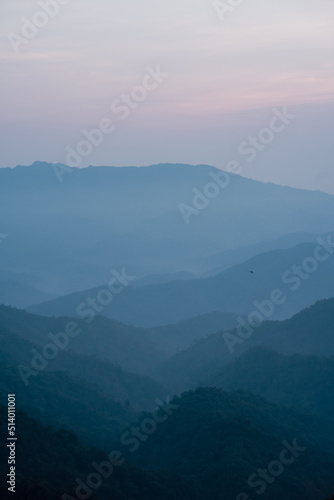 wide view layer of mountain with sunrise background