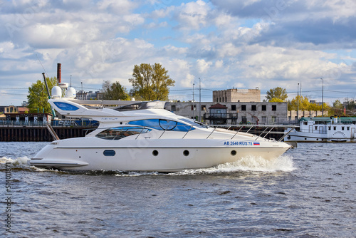 Luxury private motor yacht sailing in the river