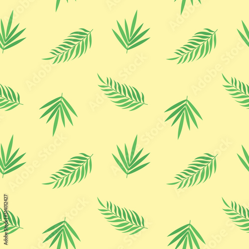 This is a seamless pattern with tropical leaves on a yellow background