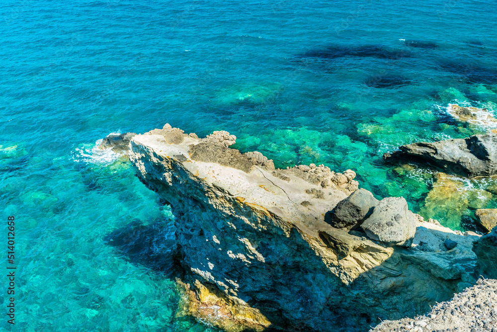 Amazing crystal clear water down the cliffs of Papafragas, Milos Island, Greece Amazing crystal clear water down the cliffs of Papafragas, Milos Island, Greece
