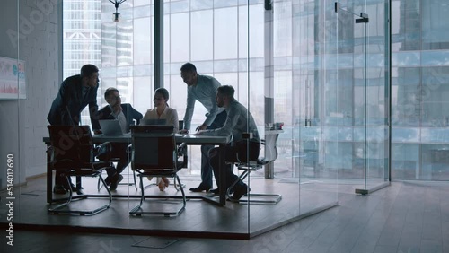 Young professionals having a discussion at a meeting in a modern office