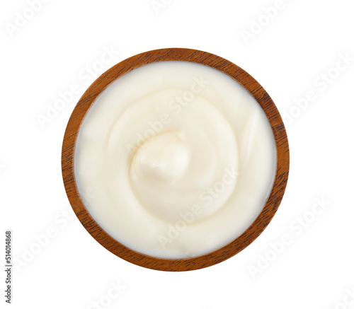 yogurt in wood spoon isolated on white background