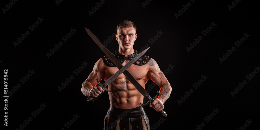 Antique warrior with sword against dark background Antique warrior with sword against dark background