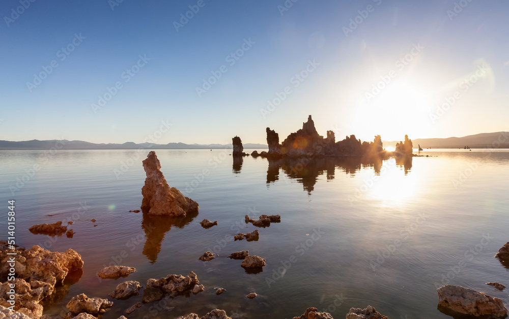 Naklejka premium Tufa towers rock formation in Mono Lake. Sunny Sunrise. Located in Lee Vining, California, United States of America. Nature Background.