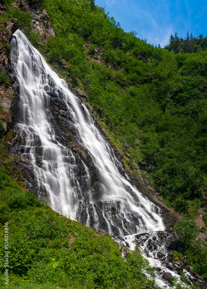 Fototapeta premium Horsetail Falls cascade down the cliffs of Keystone Canyon outside Valdez in Alaska