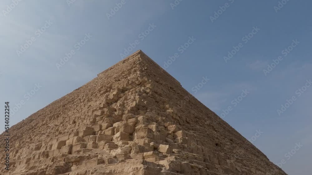 Slowly tilt down from top to buttom of Khafre Pyramid in Giza pyramid complex. Egypt Slowly tilt down from top to buttom of Khafre Pyramid in Giza pyramid complex. Egypt