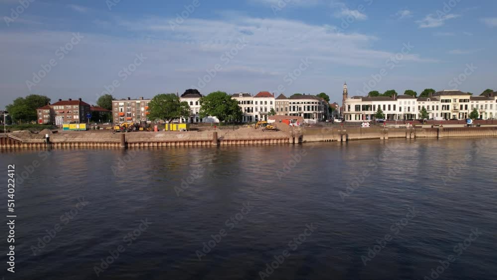 IJsselkade boulevard backwards aerial movement cityscape countenance of tower town Zutphen revealing jetty construction IJsselkade boulevard backwards aerial movement cityscape countenance of tower town Zutphen revealing jetty construction
