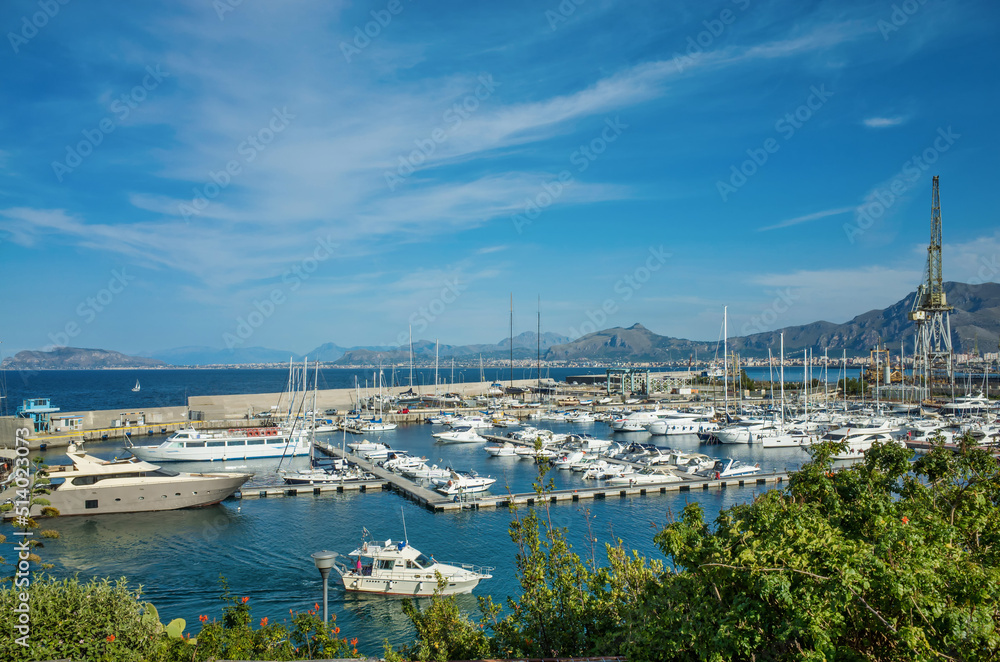 Palermo, Sicily - July 29, 2016: Small port with fishing boats in the center of Mondello
