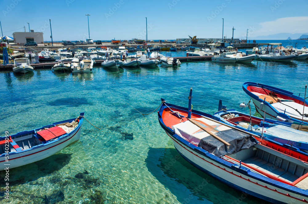 Palermo, Sicily - July 29, 2016: Small port with fishing boats in the center of Mondello