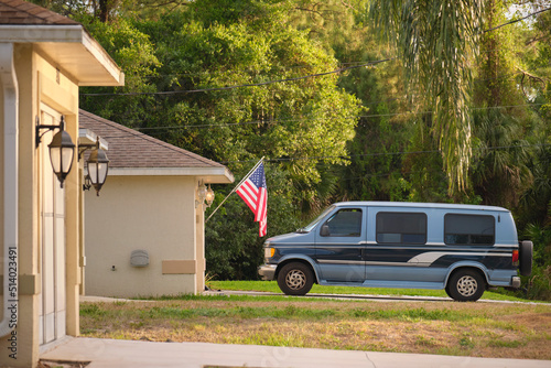 Classical americal van parked in front of a house. USA travel concept photo