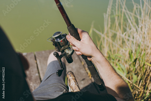A man holding a fishing rod and reel