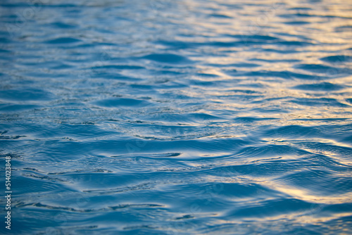 Closeup seascape surface of blue sea water with small ripple waves