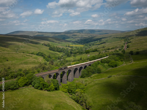 GBRf Class 66 No. 66779 'Evening Star' works 4N00 Carlisle N.Y. to Clitheroe over Dent Head Viaduct on Wednesday 15th June 2022.