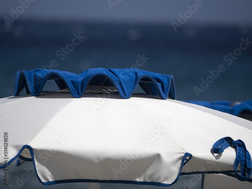 summer sun umbrellas on liguria beach