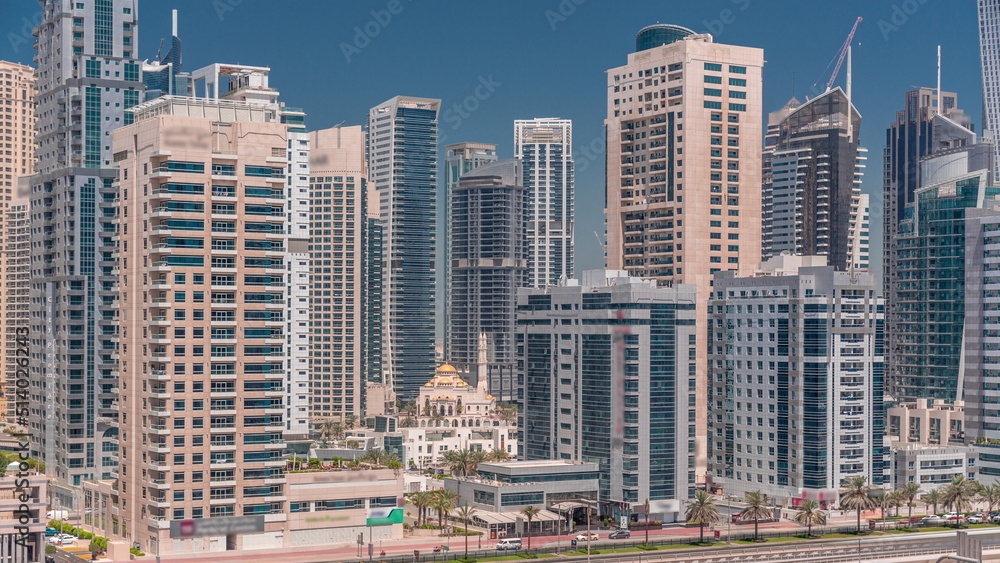 Dubai Marina skyline with Mohammad Bin Ahmed Al Mulla mosque aerial timelapse