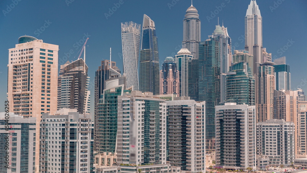 Fototapeta premium Dubai marina tallest block of skyscrapers timelapse.