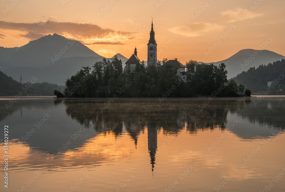 Mystical Sunrise over Lake in the Mountains