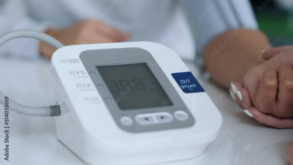 Video of beautiful female doctor measuring heart and blood pressure while taking care to patient in the medical consultation. Video of beautiful female doctor measuring heart and blood pressure while taking care to patient in the medical consultation.