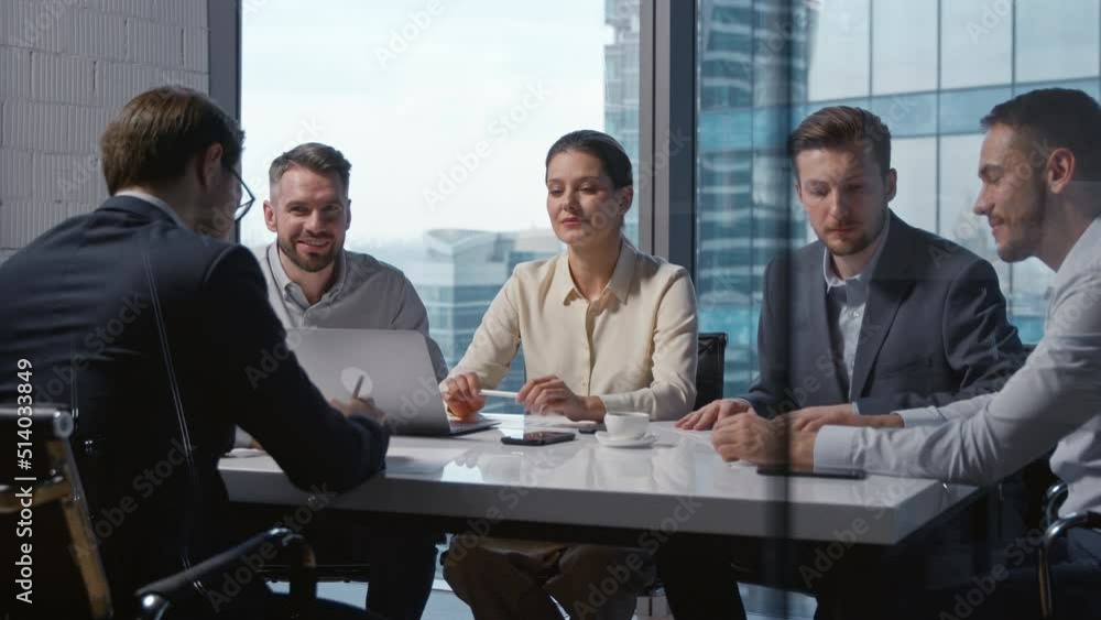 Corporate leader with a team of business people in a meeting in a modern office Corporate leader with a team of business people in a meeting in a modern office