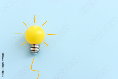 Education concept image. Creative idea and innovation. light bulb metaphor over blue background photo