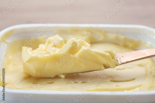 close up of fresh butter in a container 