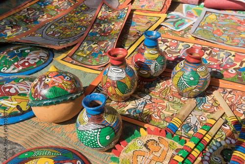 PINGLA, WEST BENGAL , INDIA - NOVEMBER 16TH 2014 : Colourful handicrafts are being prepared for sale in Pingla village by Indian rural worker. Handicrafts are rural Industry in West Bengal.