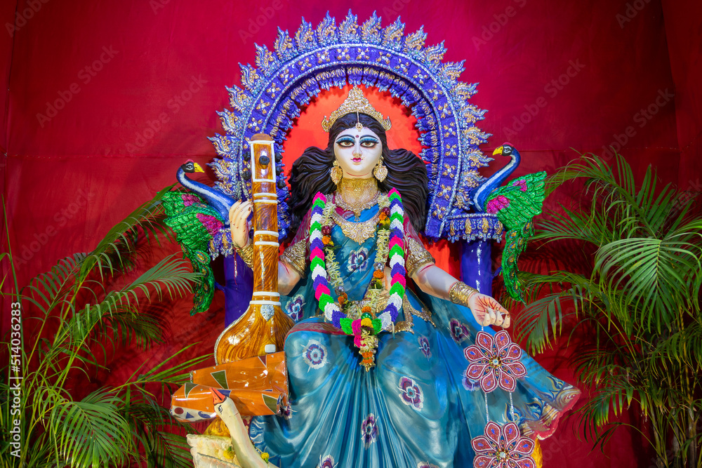 Face of Goddess Saraswati at Kolkata, West Bengal, India. Saraswati is Hindu goddess of knowledge, music, art, wisdom, and learning. Worshipping is done to get divine blessing to achieve excellence.