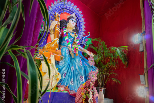 Clay Idol of Goddess Saraswati with veena, a musical instrument and white swan, a sacred bird, at Kolkata, West Bengal, India. She is Hindu goddess of knowledge, music, art, wisdom, and learning.