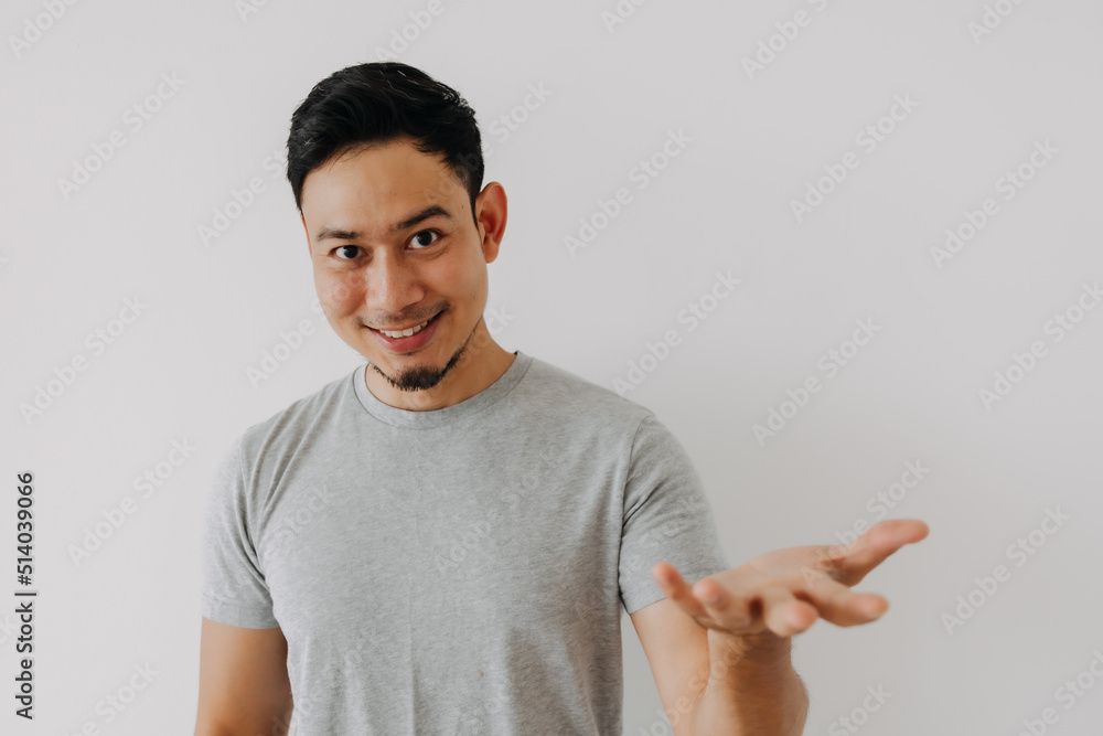 Happy smile face asian man showing empty item advertisement isolated on white. Happy smile face asian man showing empty item advertisement isolated on white.