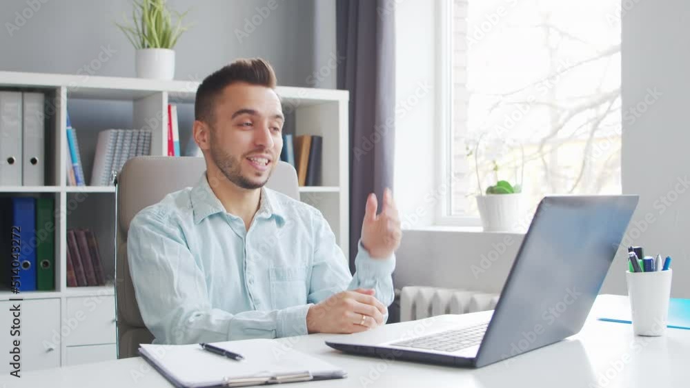 Young Teacher makes an Online Lesson while Sitting in Front of Computer at Home. The Workplace of the Tutor for School Lessons. Distant Study and Education Concept. Young Teacher makes an Online Lesson while Sitting in Front of Computer at Home. The Workplace of the Tutor for School Lessons. Distant Study and Education Concept.