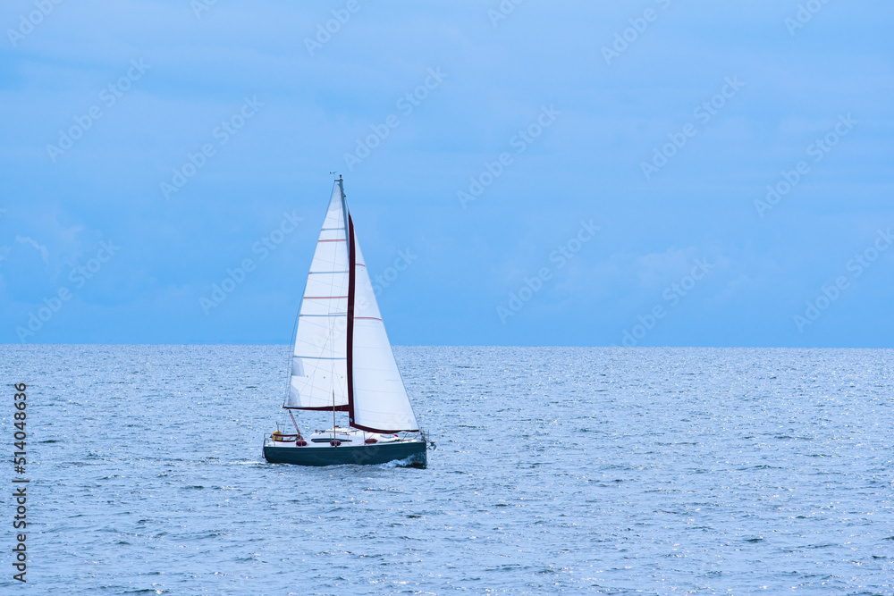 Sailing boat on the sea with blue sky